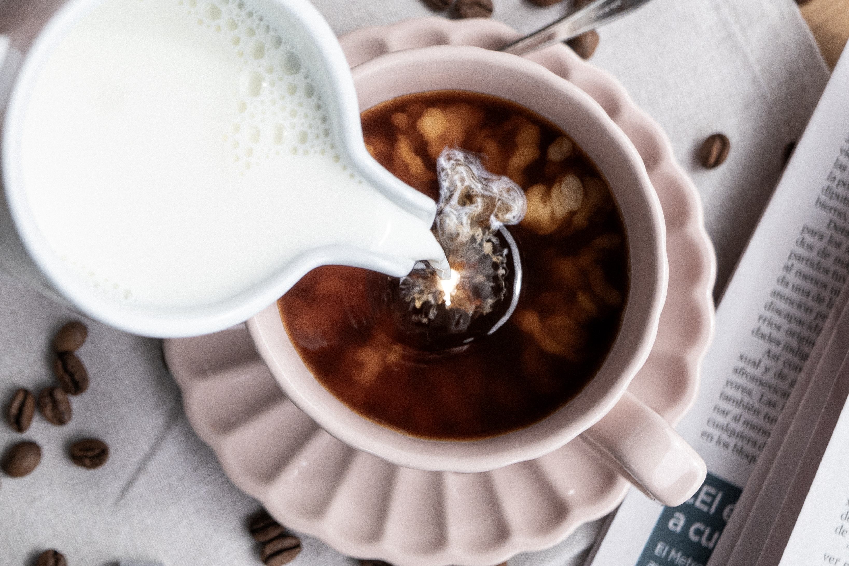 Milk being poured into AREN coffee
